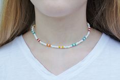 "This colorful and fun necklace reminds me of making bright tie-dye T-shirts in the summer! I love the stylish colors of this necklace. It's beachy and a perfect accessory to wear! This necklace is 16\" long on strong durable stretchy string.  Wear this necklace to accessorize your amazing summer style!" Fun White Beaded Necklaces For Summer, Casual Rainbow Necklace, White Hippie Necklace For Gift, Hippie White Necklace For Gift, Hippie White Necklace As Gift, Hippie White Necklace Gift, White Fun Necklace For Festival, White Fun Style Necklace For Festivals, Fun White Necklace For Festival