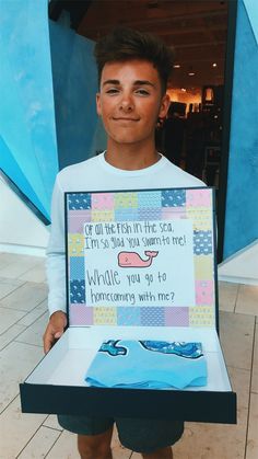 a young man holding up a sign that says, if all the fish in the sea isn't so what you seem to me