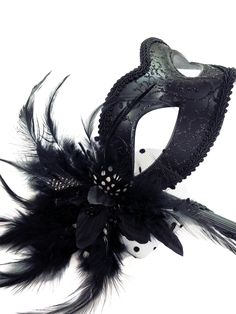 Perfect for any masquerade ball or costume party, this mask is with a holding stick for the freedom to expose your true identity effortlessly. Elegantly decorated with matching black feathers for finishing touches. Thank you for supporting small businesses and hope our products bring you and loved ones some joy and humor in these trying times. S H I P P I N G - Current processing times range 5-7 days. Pls note expedited & 1-2 day guaranteed delivery services offered will still require the same p Handheld Masquerade Mask, Black Eye Mask For Masquerade, Black Gothic Eye Mask For Masquerade, Elegant Black Masks And Prosthetics For Theater, Gothic Black Eye Masquerade Mask, Black Eye Mask For Theater Costume Accessories, Black Venetian Mask For Carnival, Black Eye Mask For Theater Costume, Elegant Black Costume Accessories For Mardi Gras