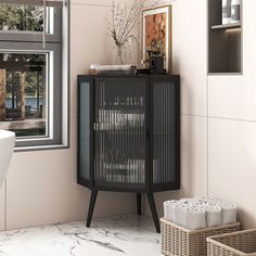 a bathroom with a black cabinet next to a white bath tub and window in the background