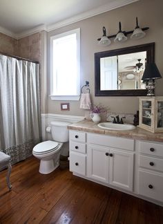 the bathroom is clean and ready to be used for cleaning or remodeling