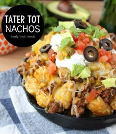 taco tot nachos in a cast iron skillet