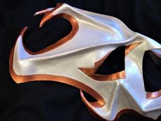 DESCRIPTIONGrant 3 wishes... Wear this white mask lined in coppery bronze to embellish your Genie / Jinn cosplay costume. This leather helm-like mask is a lightweight accessory for an SCA figher, LARP warrior. Get in Bronze, brown, or gold for Roman Gladiator. Wear for Goddess / God cosplay. Any color. Waterproofed for outdoor SCA events and Renaiisance Faire, and lightweight for wearing all day at convention! Use for Halloween, Comicon, Cosplay conventions, fandom events, Greek God Cosplay. Wat God Cosplay, Larp Warrior, Gladiator Warrior, Genie Costume, Comicon Cosplay, New Years Eve Ball, 3 Wishes, White Mask, Leather Mask