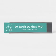 a green sign with a stethoscope on it that says dr sarah dunbar, md your text here