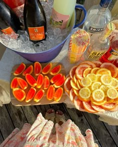 there are many different types of fruit on the table together, including oranges and lemons