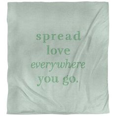 a green towel with the words spread love everywhere you go