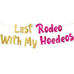 a banner that says last rodeo with my hodelos hanging from a string on a white background