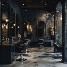 the interior of a hair salon with black walls and chairs, chandeliers and mirrors