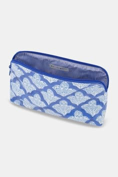 a blue and white pencil case with hearts on it