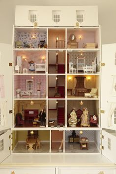 a doll house with all the furniture and accessories in it's display case is shown