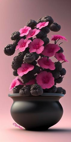 a black vase with pink flowers in it