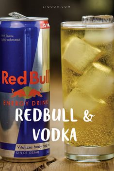 a can of red bull energy drink next to a glass with ice