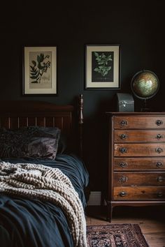 a bedroom with a bed, dresser and pictures on the wall