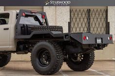 an off - road vehicle parked in front of a building with the starwood motors logo on it