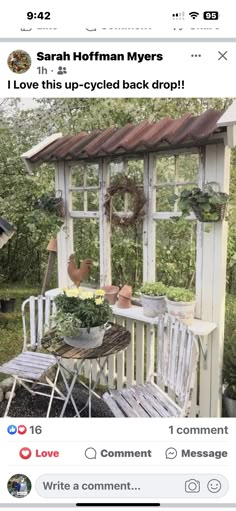 an image of a small gazebo with flowers in the window and plants growing out of it