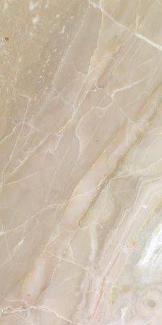 the marble is beige and white with brown streaks