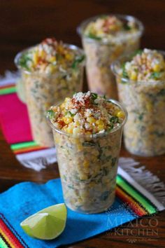 three small cups filled with food on top of a table