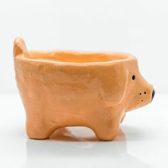 a ceramic bear planter sitting on top of a white table