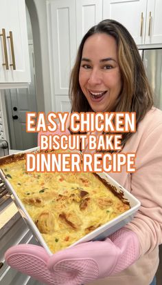 a woman holding up a casserole dish with the words easy chicken biscuit bake dinner recipe