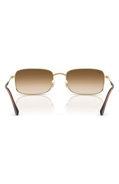 A sleek rectangular silhouette adds retro-cool appeal to stylish sunnies fitted with adjustable nose pads for a secure fit. 59mm lens width; 20mm bridge width; 145mm temple length 100% UV protection Adjustable nonslip nose pads Metal Imported Classic Rimless Shield Sunglasses With Gradient Lenses, Gold Rectangular Sunglasses With Tinted Lenses, Classic Rimless Sunglasses For Summer, Gold Rectangular Tinted Sunglasses, Modern Rectangular Aviator Sunglasses With Uva Protection, Classic Rimless Aviator Sunglasses With Tinted Lenses, Gold Rectangular Sunglasses With Mirrored Lenses, Elegant Rectangular Shield Sunglasses With Uva Protection, Classic Rimless Tinted Aviator Sunglasses