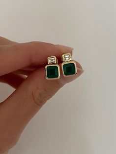 DETAILS: - Approx. 2 carats of emeralds - .28 carats of emerald cut diamonds  - set in 14k yellow gold Green Emerald Diamond Earrings, Emerald Earrings In Yellow Gold, Timeless Green Emerald-cut Jewelry, Emerald-cut Emerald Diamond Earrings, Panna Ring, Gold Emerald-cut Emerald Earrings, Emerald Studs, Bezel Bracelet, Emerald Green Earrings