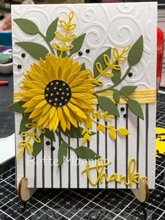 a handmade thank card with a sunflower on it