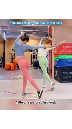 two women are doing exercises in the gym