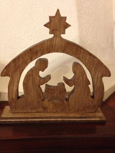 a wooden nativity scene with the birth of jesus