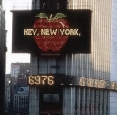 the new york times square sign has an apple on it's back and says hey, new york