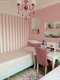 a bedroom with pink and white stripes painted on the walls, two twin beds are in front of each other