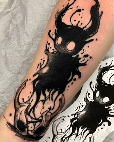 a black ink tattoo on the arm of a person with a deer head and flames