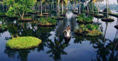 there is a boat in the water surrounded by palm trees and small islands with people on it