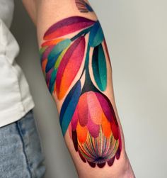 a person with a colorful tattoo on their arm