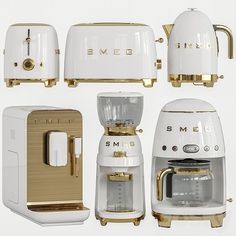 there are many different types of appliances on this white table top with gold trimmings