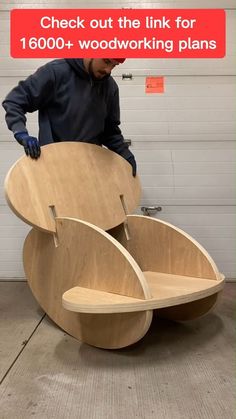 a man standing next to a large wooden object with the words check out the link for 1, 600 + woodworking plans