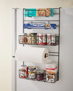 a refrigerator door is open and has two shelves with food on them