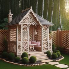 a small gazebo in the middle of a garden