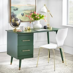 a green desk with two white chairs and a painting on the wall in front of it