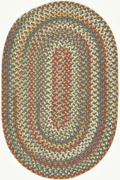 the oval rug is multicolored and has an oval shape