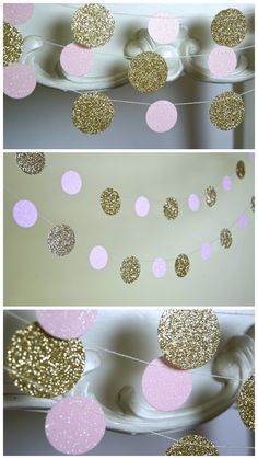 some pink and gold decorations hanging from a white tablecloth with polka dots on it