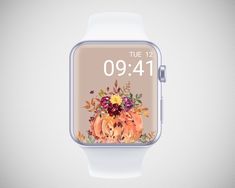 an apple watch with the time displayed on it's screen and flowers in the center