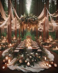 an outdoor wedding setup with candles, flowers and greenery on the tables in the woods