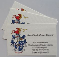 three business cards with the coat of arms and motto on them, all in white paper