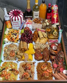 a table filled with lots of different types of food and condiments on it