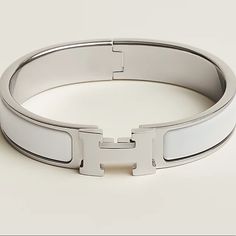 Classic Hermes Bracelet. Color Is White With Silver Hardware. The Size Is Pm (The Smaller Of The Two Sizes). Comes In Original Packaging. Super Minimal Scratching On The Back Of The Bracelet As Seen In The Images. I’m Almost Perfect Condition! Retails For $660 Hermes Clic H Bracelet, H Bracelet, Hermes Bracelet, Hermes Jewelry, Almost Perfect, Silver Hardware, Womens Jewelry Bracelets, Two By Two, Women Jewelry