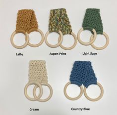 crocheted baby mittens and rattles are shown with names on the handles