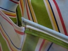 a close up view of a green and white striped bag