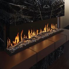 a large fireplace with lots of flames in it