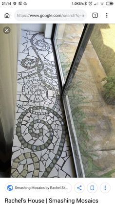 the floor is covered in mosaic tiles and has a glass door leading to an outside patio