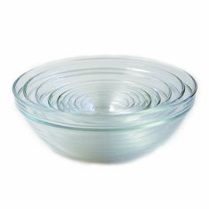 three clear glass bowls stacked on top of each other in the shape of spirals